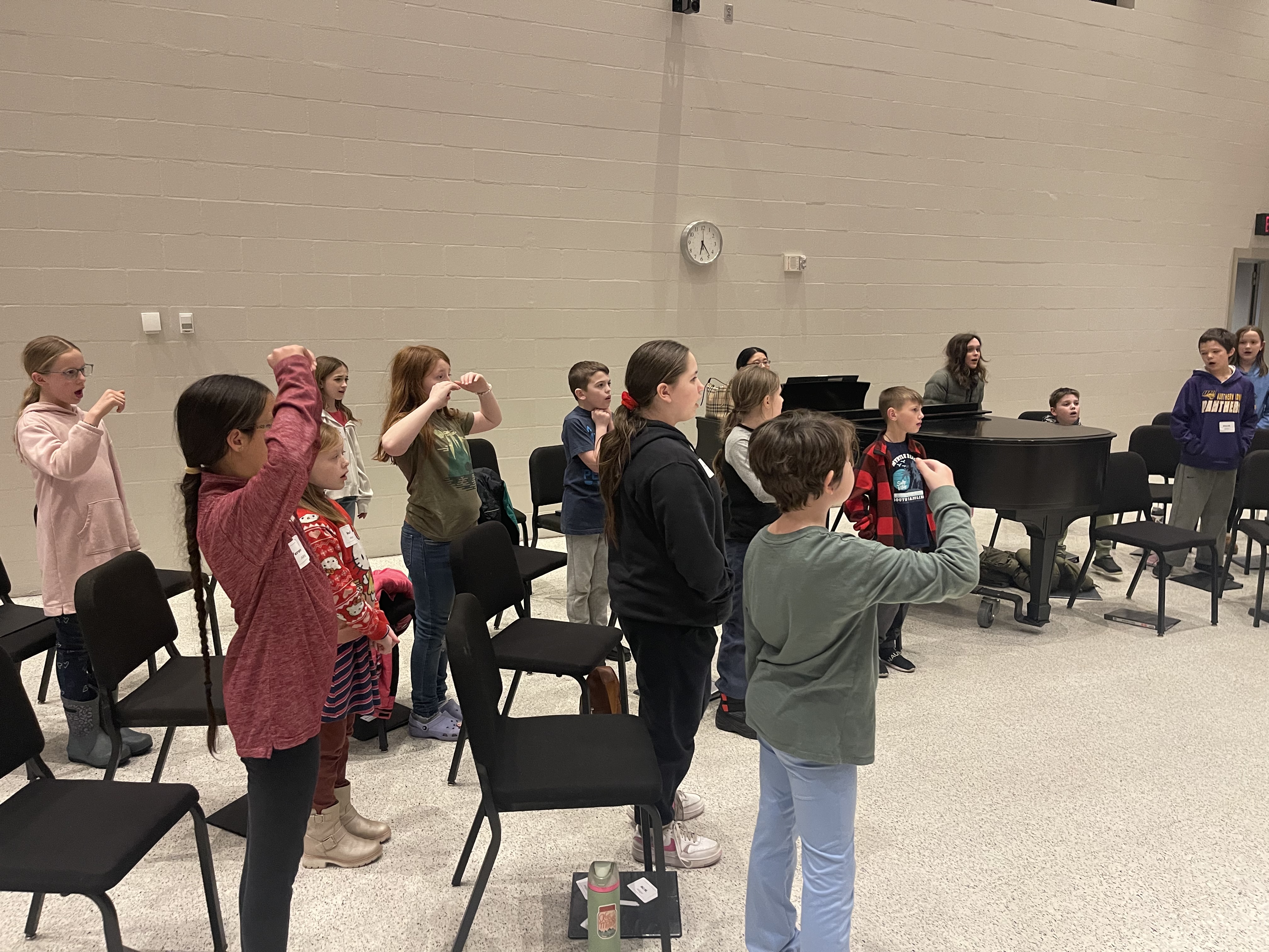 Choir members singing using solfege