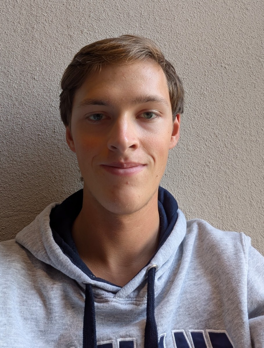 Kyle Langston Head shot. Wearing grey hooded sweatshirt.