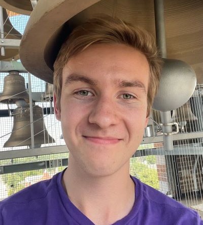 Patrick Mooney standing amongst Carillon bells