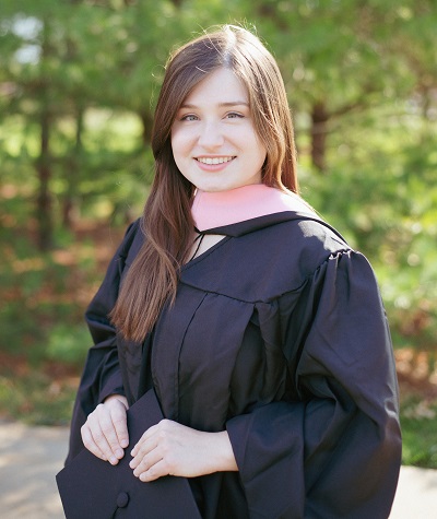 Christine Compton in graduation gown, holding cap