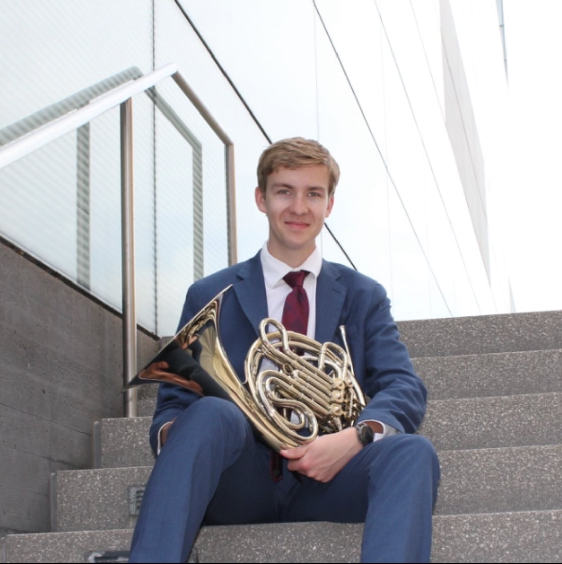 Patrick holding a french horn