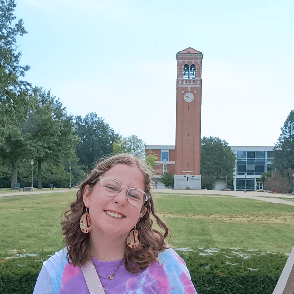 Guild president, Caroline Schafer, standing in front of the Campanile.