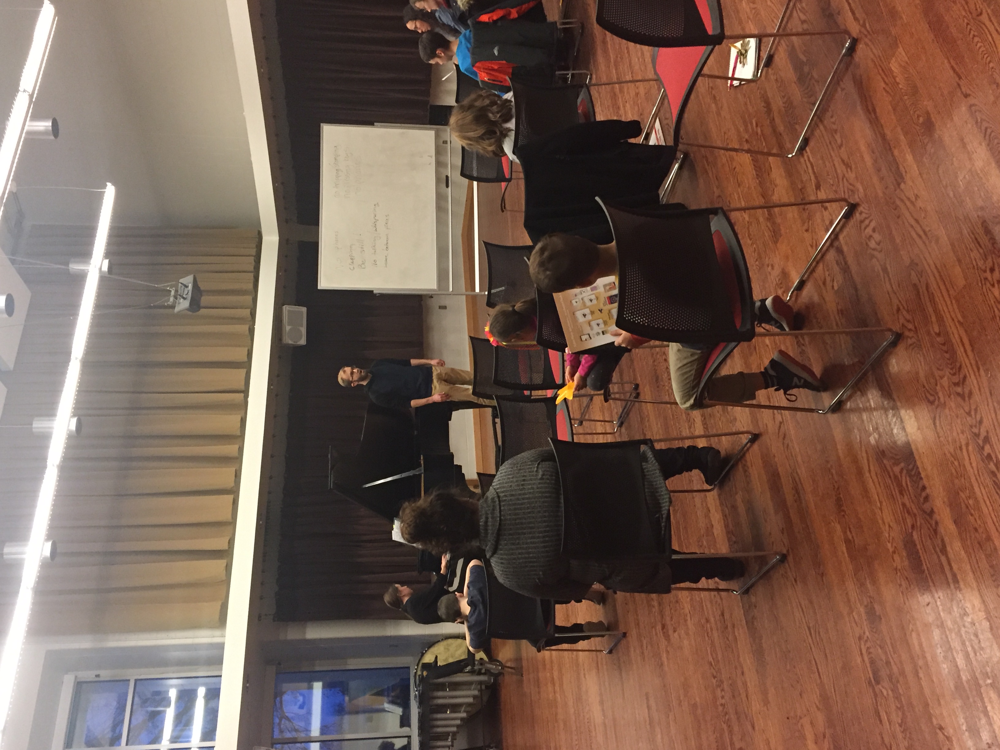 Teachers demonstrating performance techniques in performance class to students.