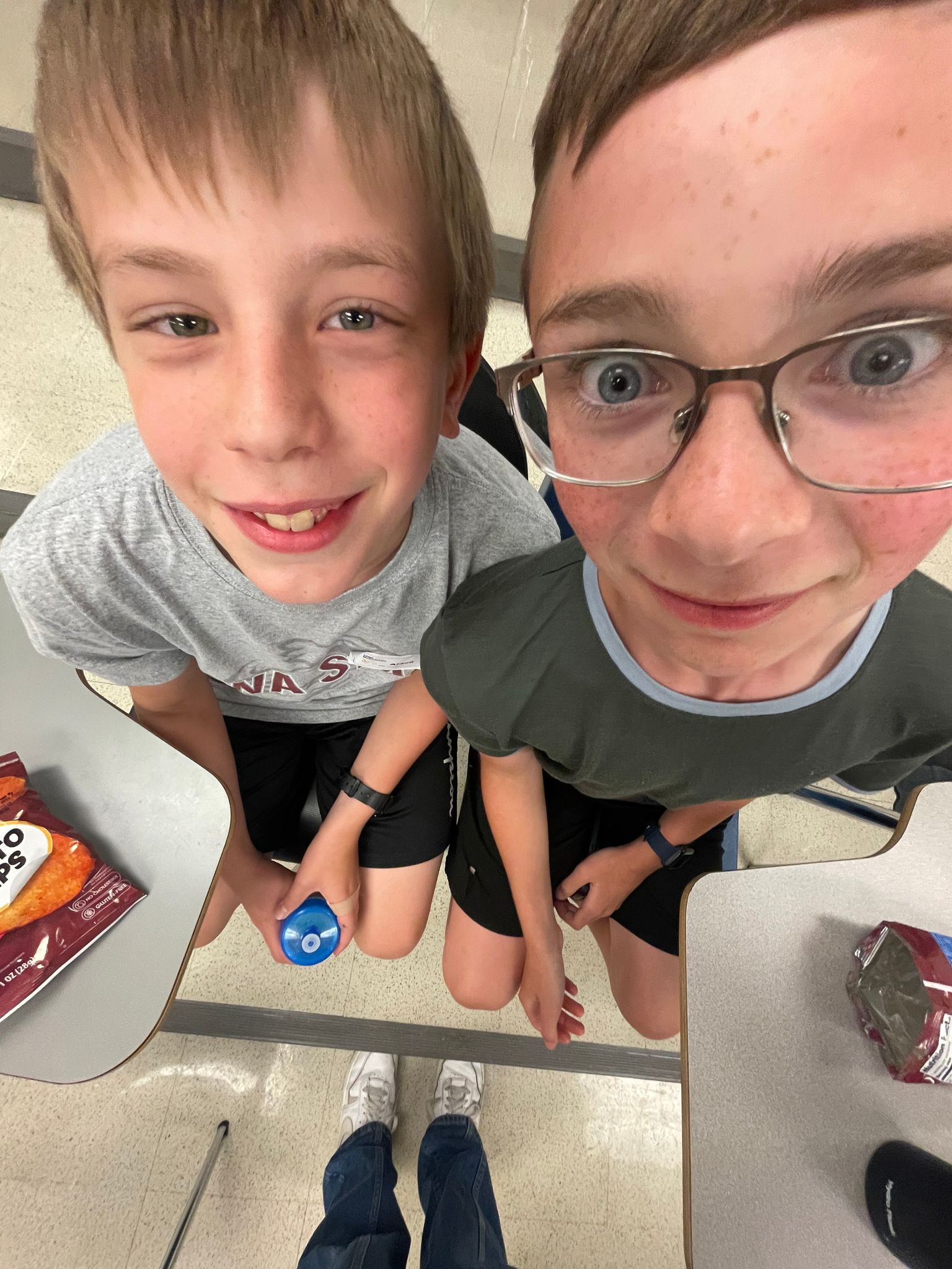 Two male students making silly faces.
