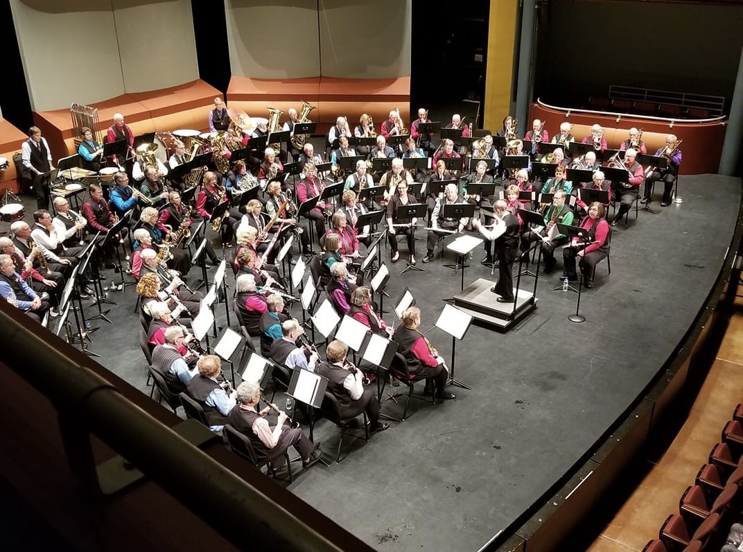 New Horizons Band playing on stage during a concert