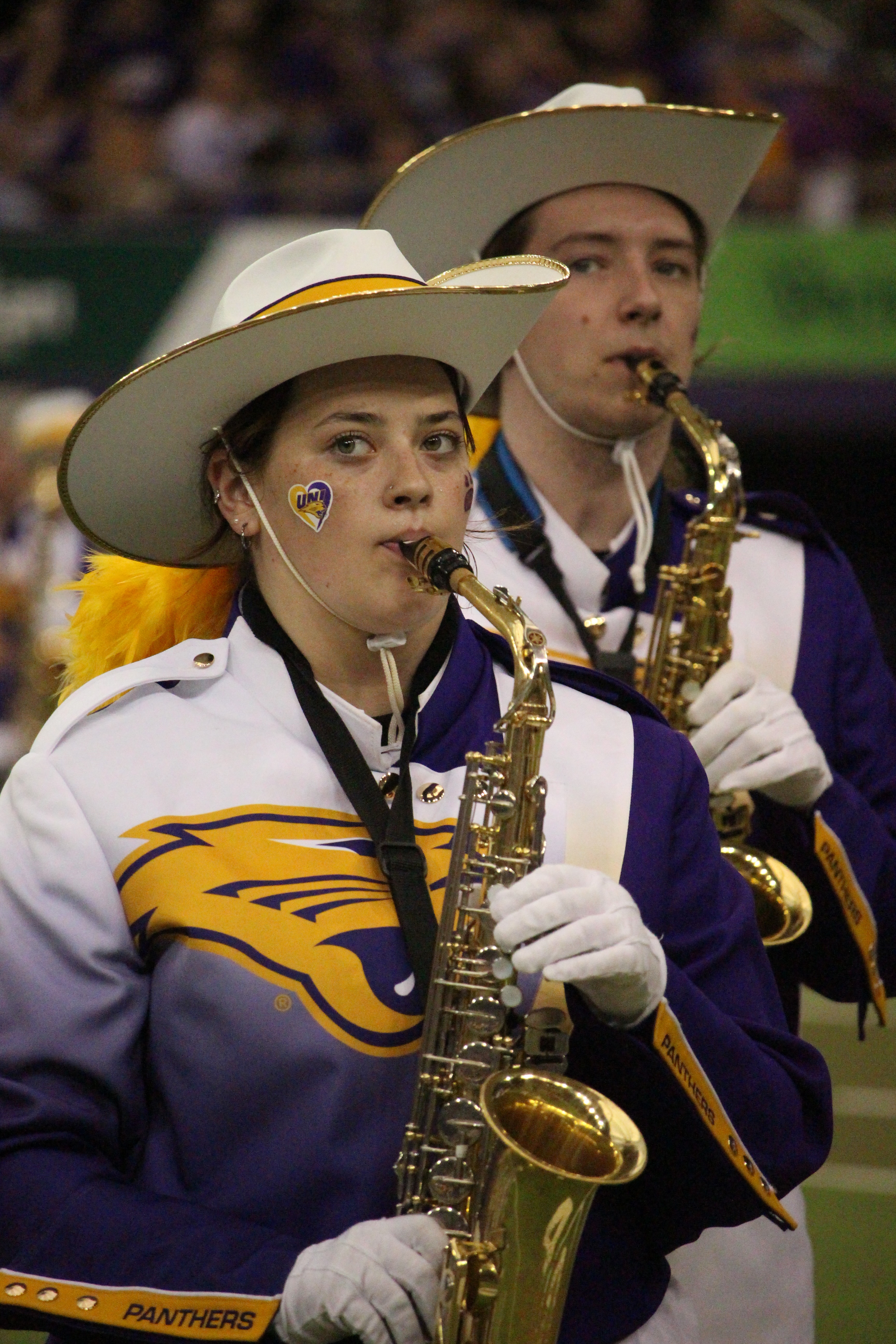 PMB performing on the field, featuring alto saxophones.