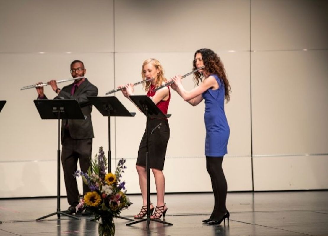 three flute players on stage