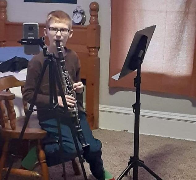 Student with a wind instrument.