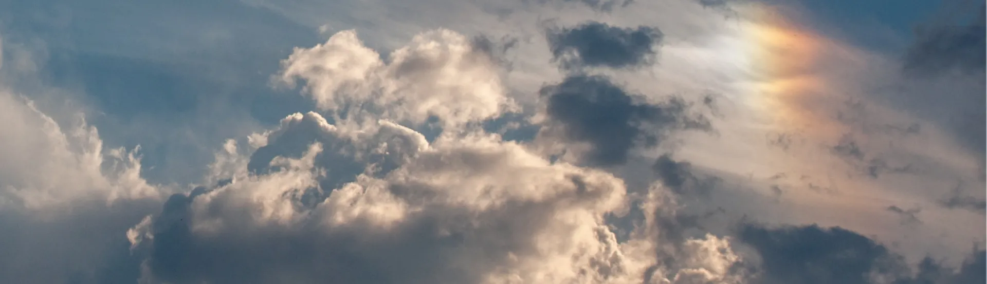 Image of sky, clouds and rainbow